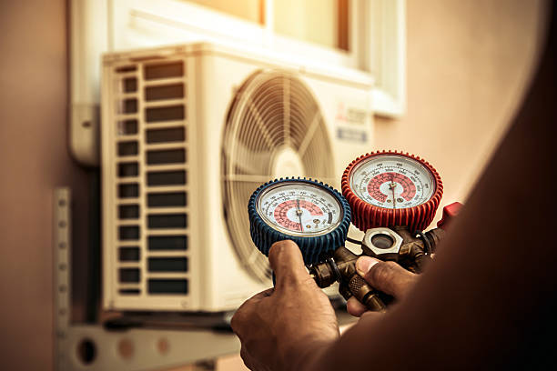 Professional Air Conditioning Service technician working in Milford, MA